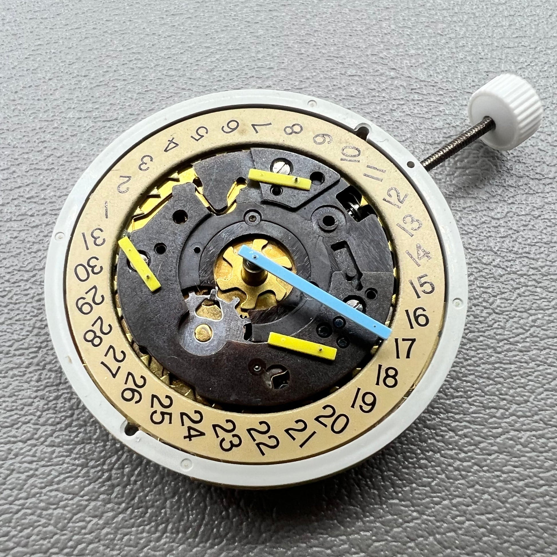 Swiss ISA 8162 golden watch disk with date feature, quartz movement replacement by ISA, ideal for watch repair.