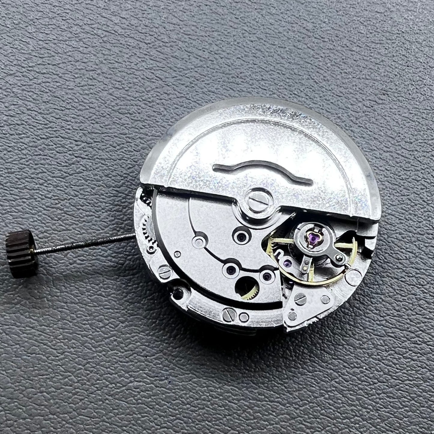 Dandong Silver automatic watch accessory showcasing precise mechanical movement with second stop feature.