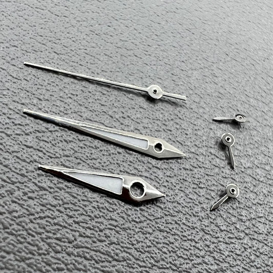 Set of 2 silver-trimmed green lume arrow-shaped watch hands for VX3J, VX9J, VX7J, VX3N, VX9N movements.
