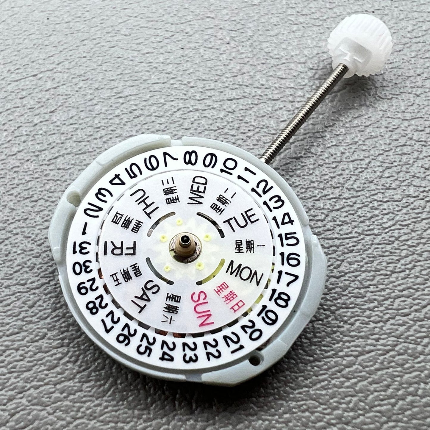 1. Sunon PE25 quartz watch movement featuring 3 hands and day-date display for precise timekeeping.  