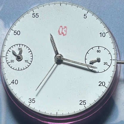 Dandong 7750 watch accessory featuring mechanical movement with double seconds and small second hands at 3 and 9 o'clock positions.