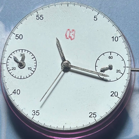 Dandong 7750 watch accessory featuring mechanical movement with double seconds and small second hands at 3 and 9 o'clock positions.