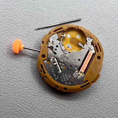 Japan Miyota GP00 quartz watch movement close-up, precision timekeeping mechanism for watches.