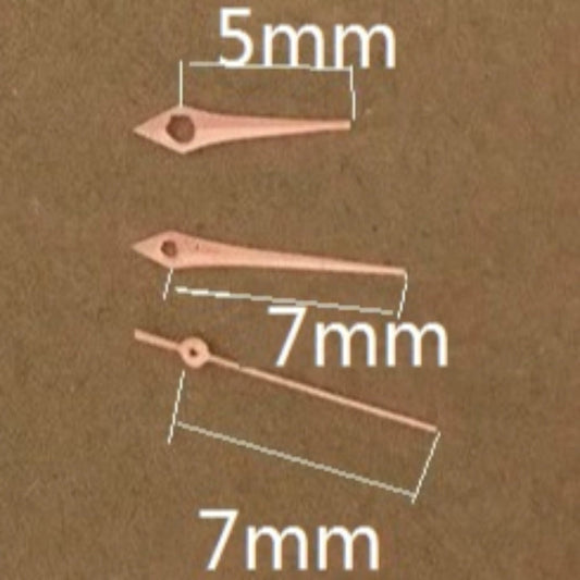 Rose Gold arrow-shaped watch hands, 7x7x5mm, compatible with Miyota 2035 quartz movement. Elegant trim detail.