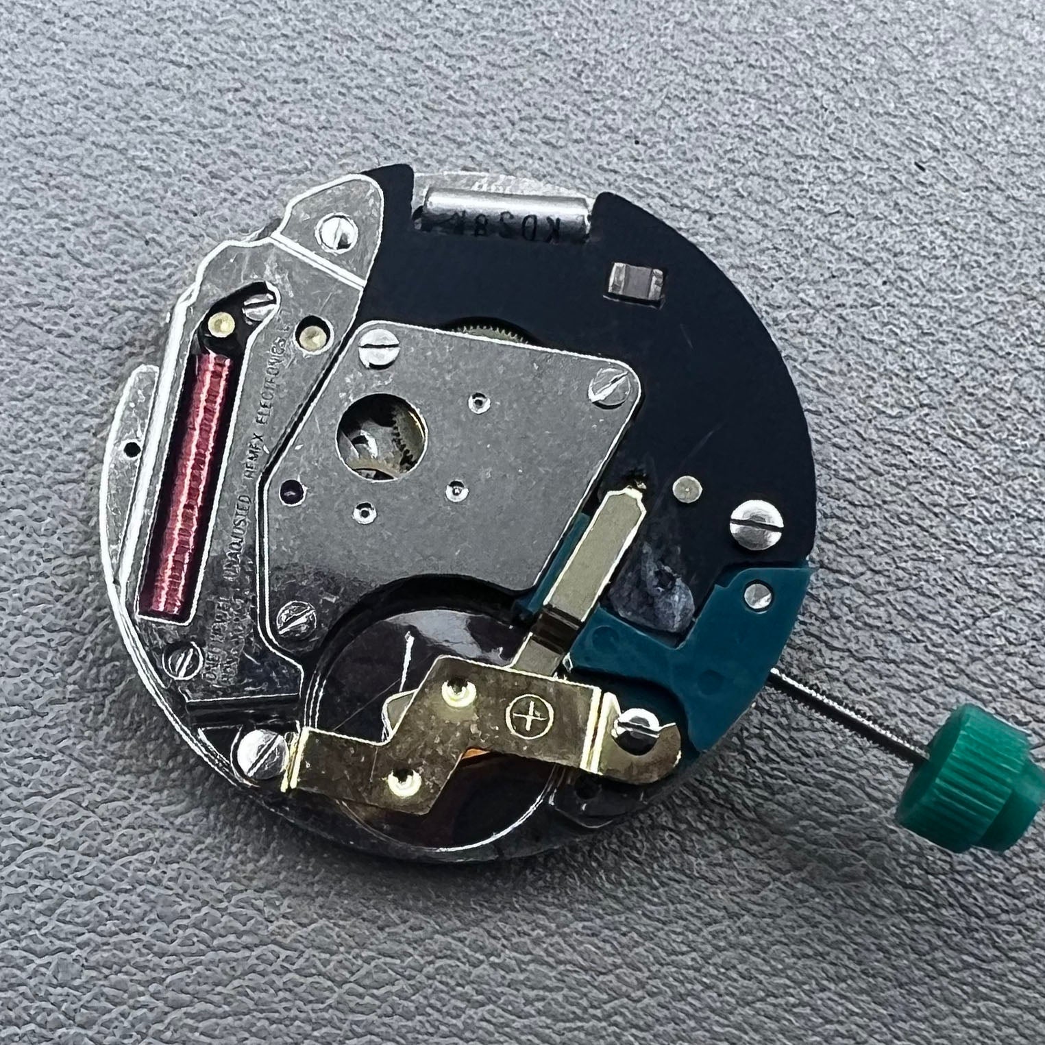 Swiss ETA 6640B quartz watch movement with 3 hands and black circuit board for precise timekeeping.