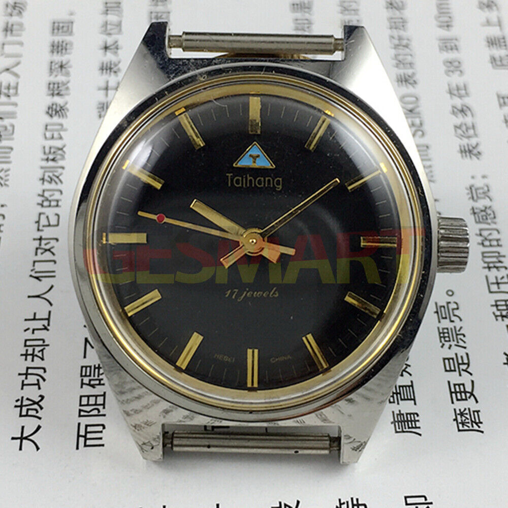 Chinese Taihang 32mm manual mechanical watch with 17 jewels, black dial, and golden nail markers.