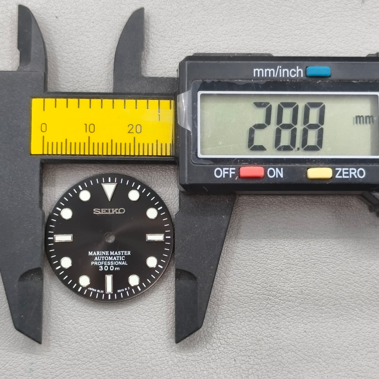 watch dial with S logo