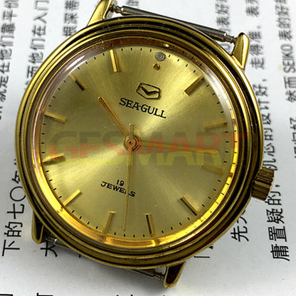 35mm Tianjin Seagull watch with golden case, round dial, manual mechanical movement, classic style accessory.