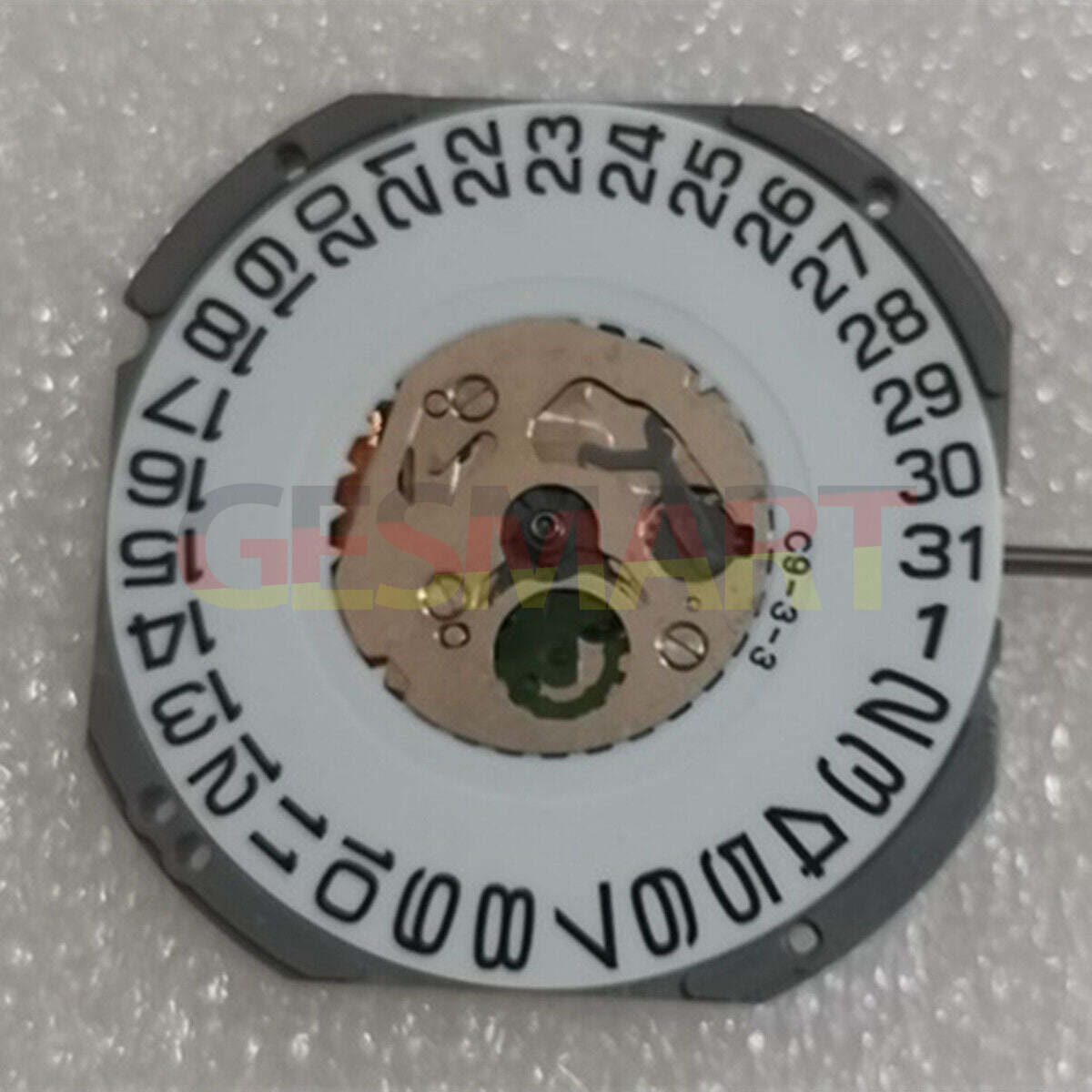 Quartz watch movement Miyota 1S12 with 3 hands, date at 3 o'clock, and watch stem for precise timekeeping.