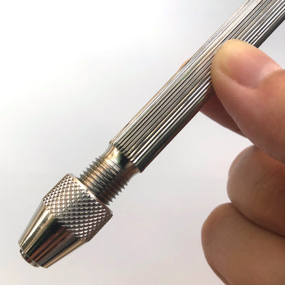 Bergeon 1842-17A pin vise gripping small watch parts, ideal for precision repairs and detailed craftsmanship.