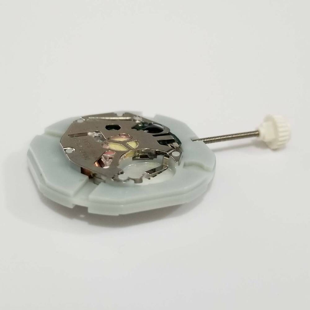 SUNON PE28 quartz watch movement showing day and date functions for accurate timekeeping and repair.