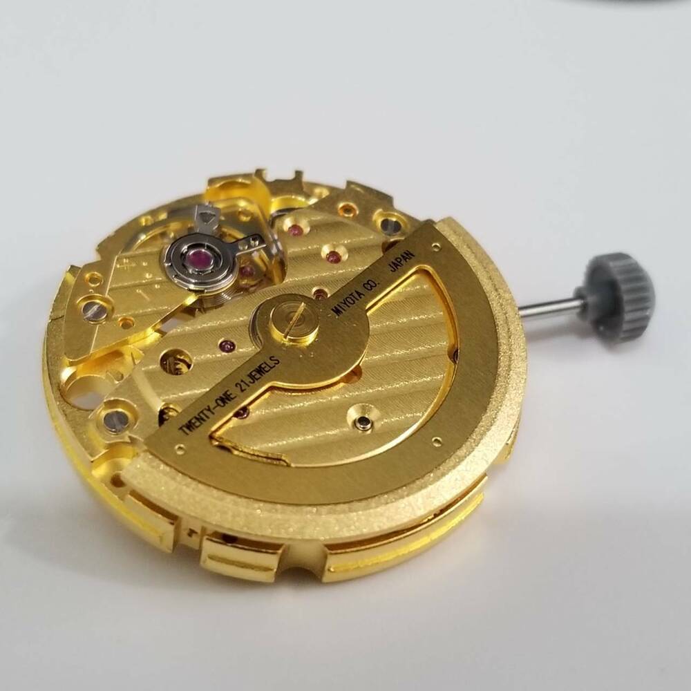 Golden Miyota 82S7 automatic movement by Miyota for precise watch repair parts.