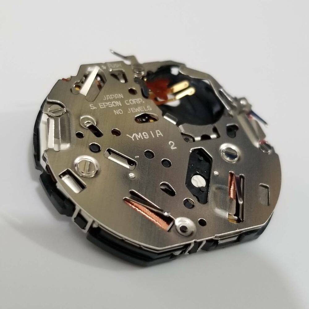 S. Epson YM91 quartz watch movement, precise repair part for durable timepiece maintenance.