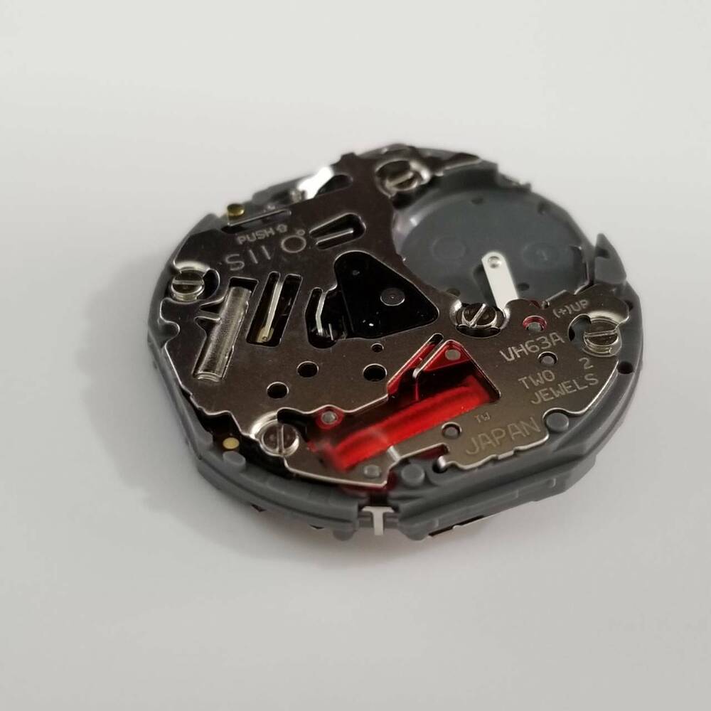 Hattori Epson VH63A quartz watch movement, precision Japanese repair part for accurate timekeeping.