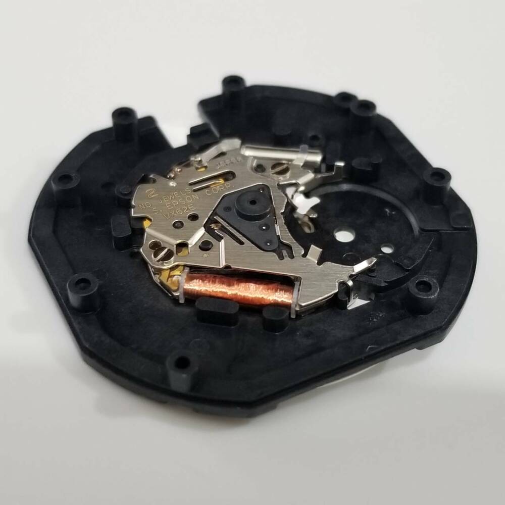 S. Epson VX62 quartz watch repair part with date display at 3 o'clock, precise timekeeping component.
