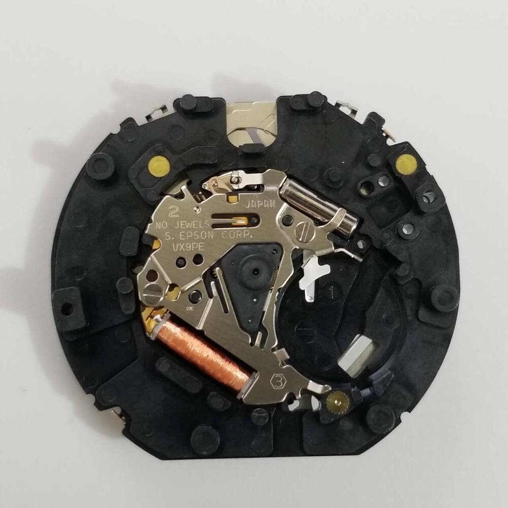 S. Epson VX9P quartz watch movement showing detailed components for accurate timekeeping.