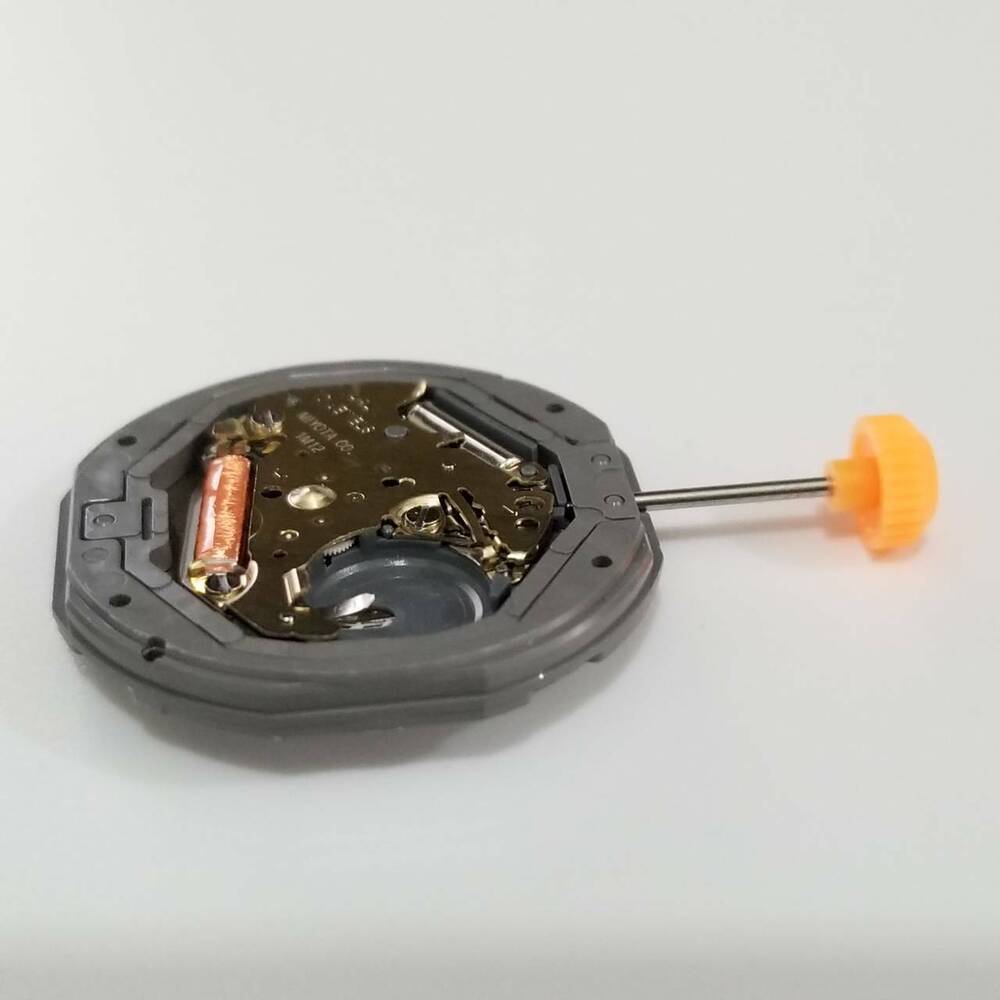 Miyota 1M12 quartz watch movement repair part, compatible with models 1110 and 1112, ensures precise timekeeping.