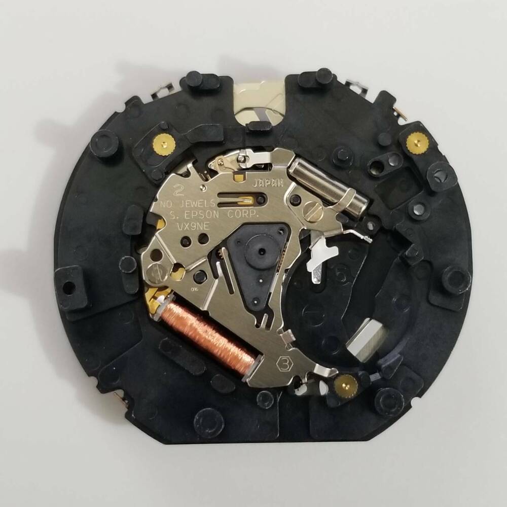 S. Epson VX9N quartz movement part, precise watch repair component for accurate timekeeping.