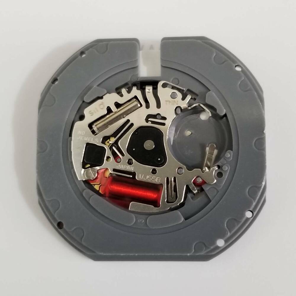 Hattori Epson TMI VJ55 quartz watch movement with date at 6, Japan-made for accurate repairs.