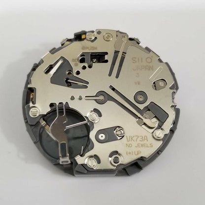 Hattori Epson TMI VK73 quartz watch movement, precise repair part for accurate timekeeping.