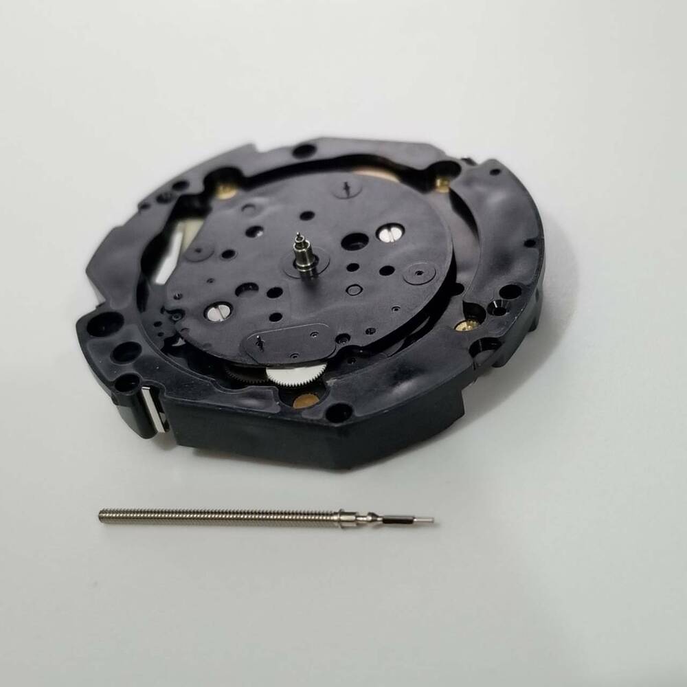 Hattori Epson VD32A quartz watch movement, precision Japanese repair part for timepieces.