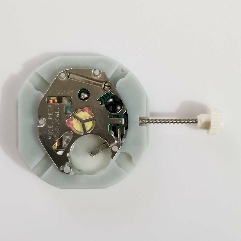 SUNON PE28 quartz watch movement showing day and date functions for accurate time repair parts.