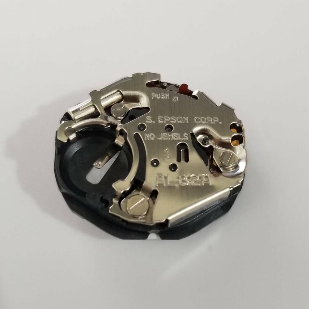 S. Epson AL82 quartz watch movement part for precise timekeeping in watch repairs.