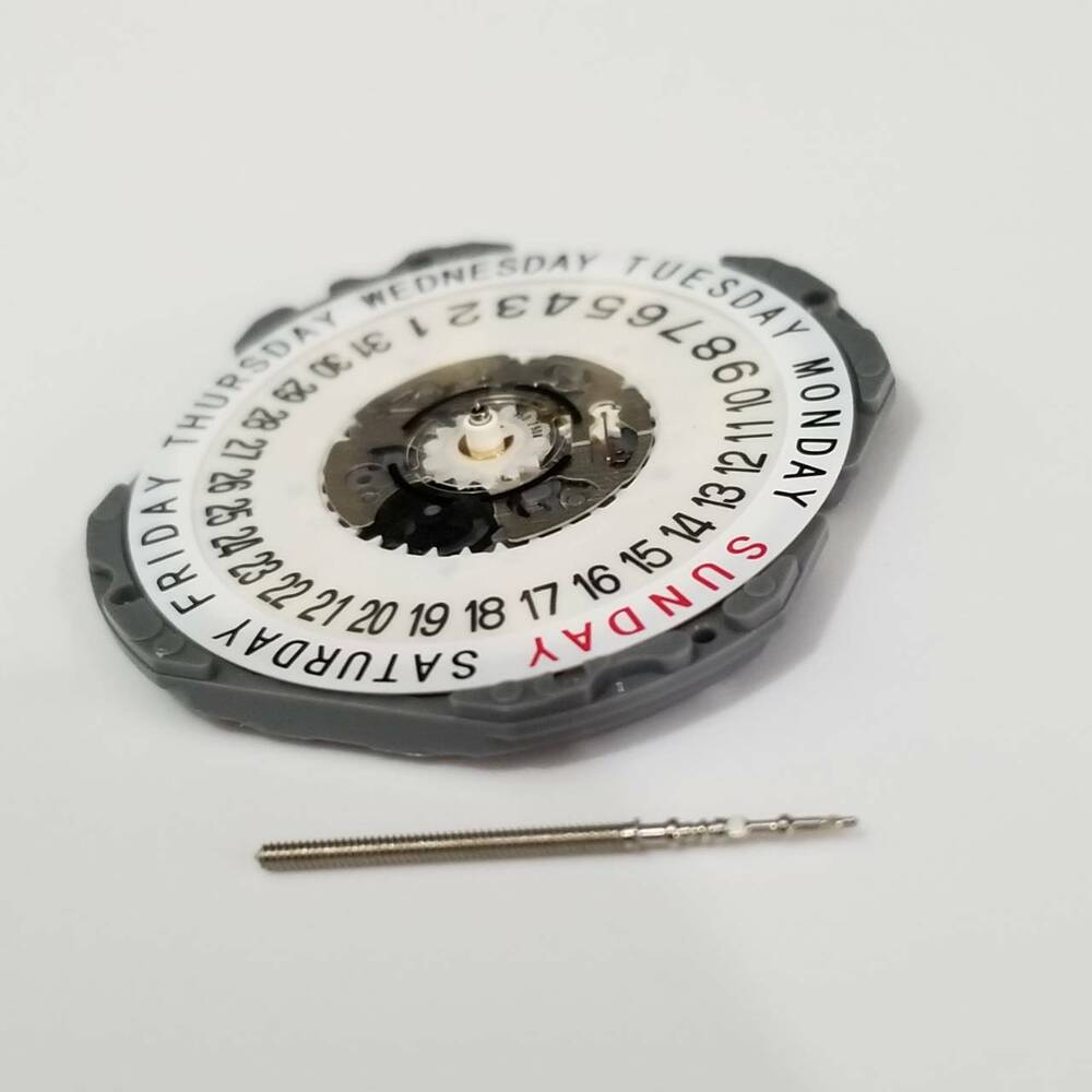 Hattori Epson TMI VJ55 quartz watch movement with date at 6, Japan-made for precise repairs.