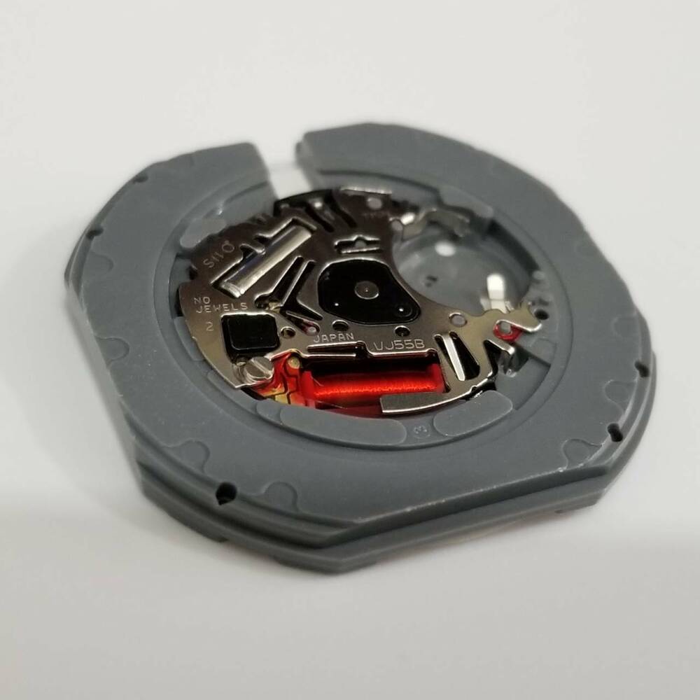 Hattori Epson TMI VJ55 quartz watch movement with date at 6, Japan-made for accurate repairs and replacements.