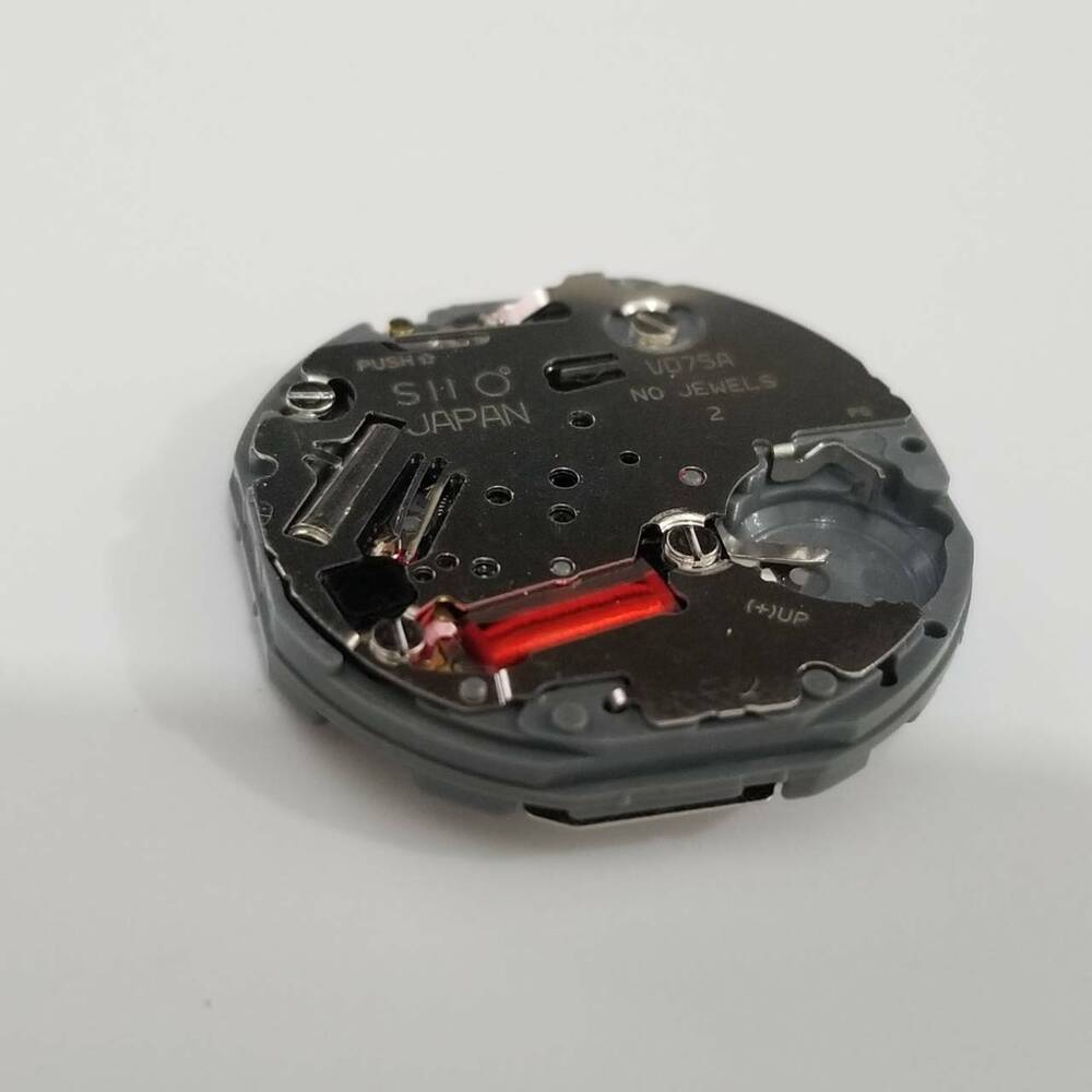 Hattori Epson VD75A quartz watch movement by TMI, precise Japan-made component for repair.
