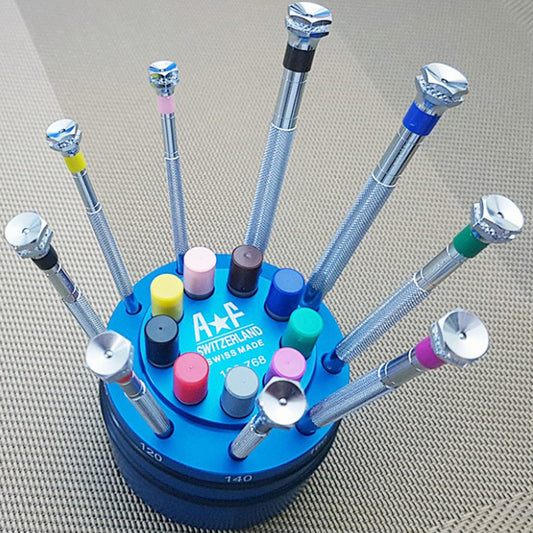 A*F 189.768 set of 9 precision screwdrivers with spare blades and sturdy base for watch accessory repair.