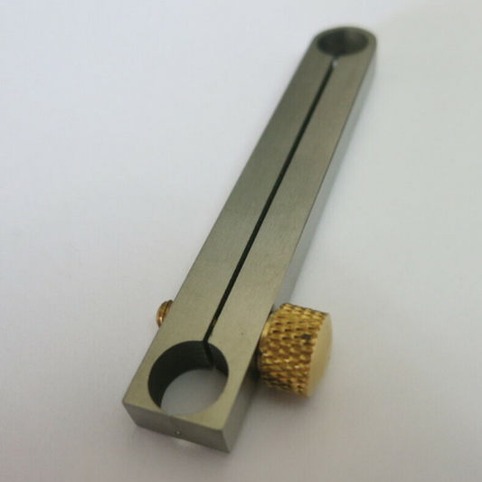 Centre wheel clamp tool for precise watch movement repair and assembly.