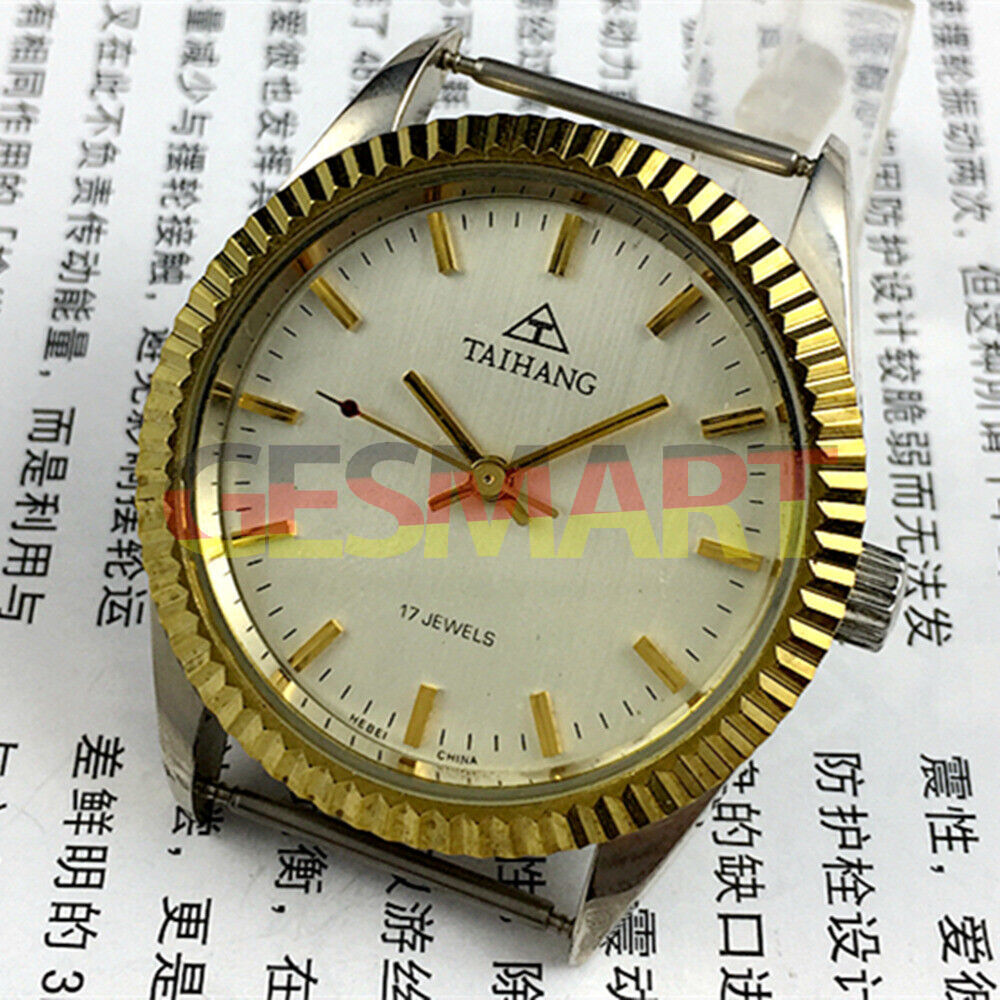 38mm TAIHANG manual watch with golden nail markers, silver dial, and 17-jewel mechanical movement.