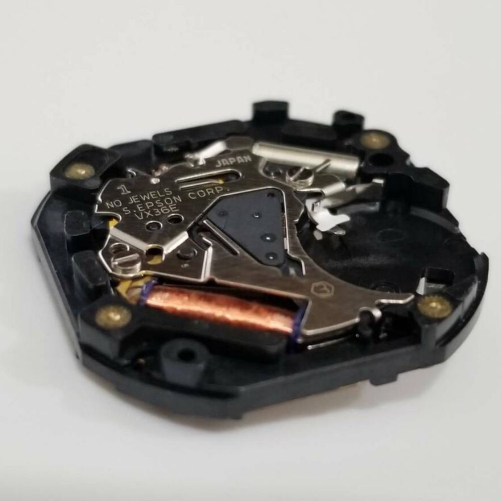 Epson VX36 quartz watch movement, precise timekeeping replacement part for watch repair.