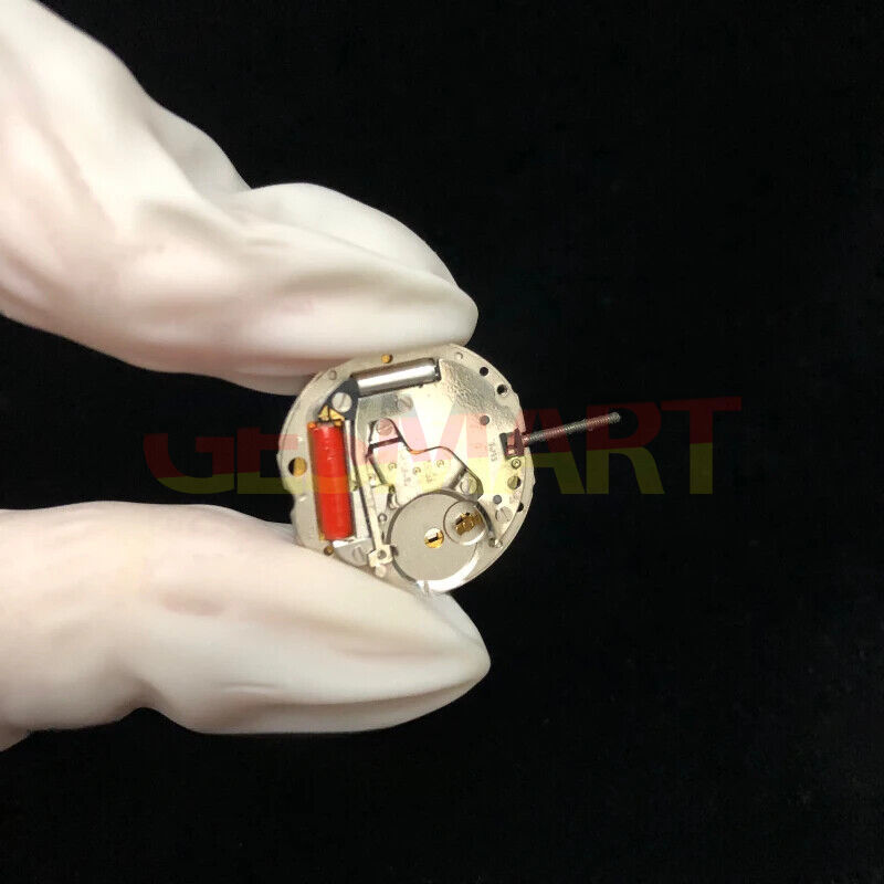 Close-up of Original Swiss RONDA 785 golden silver quartz calendar movement, precision watch accessory by RONDA.