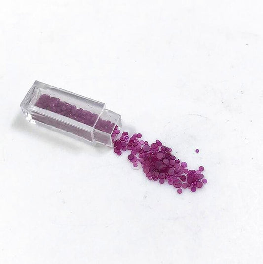 Set of 100 red gemstone top cap jewels for precise watch repair and replacement tasks.