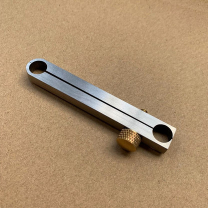 Metal manual center wheel remover tool for precise professional watch repair.