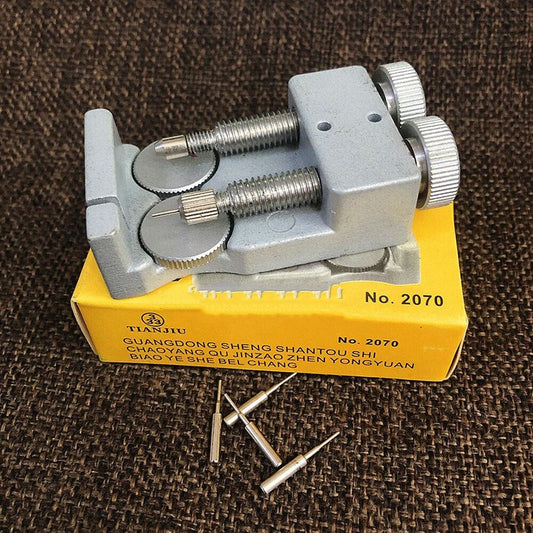 Adjustable metal link remover tool with 4 pins for watch band repair.