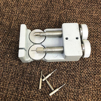 Adjustable metal link remover tool with 4 pins for precise watch band repair.