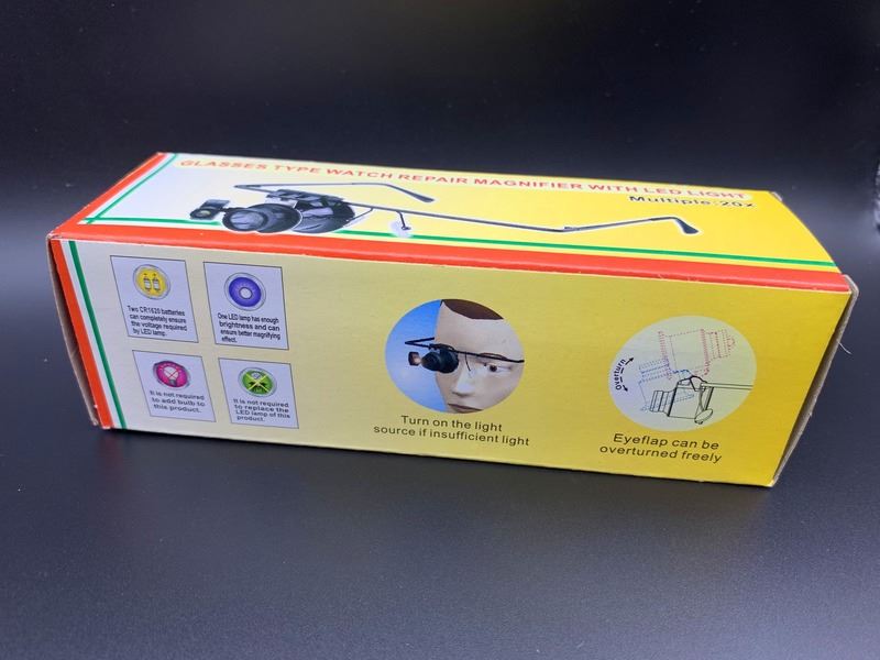 Eye magnifier with dual LED lights, ideal for detailed watch repair tasks.