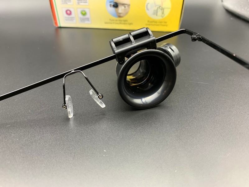 20X watch repair eye magnifier with dual adjustable LED lights for detailed accessory work.