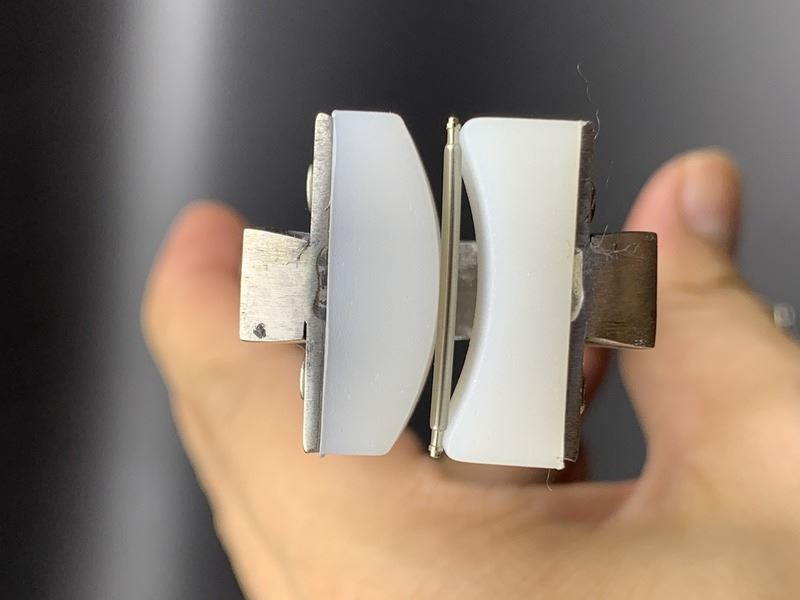 Spring shaft pliers for precise watchband adjustment with steel bracelet and connecting ear rod.