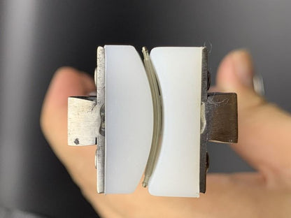 Spring shaft pliers for precise watchband adjustment with steel bracelet and ear rod.