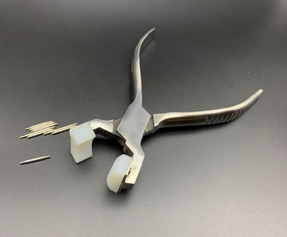 Spring shaft pliers for precise watchband adjustment with steel bracelet and connecting ear rod.