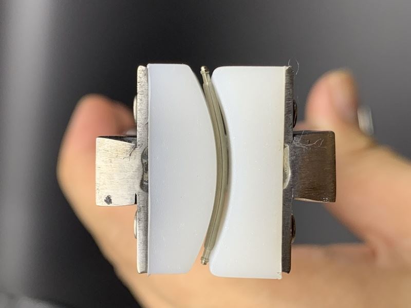 Spring shaft pliers for precise watchband adjustments on steel bracelets with connecting ear rod.