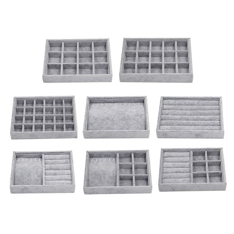Gray velvet stackable jewelry organizer tray, ideal for displaying and storing accessories neatly.