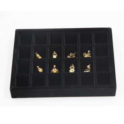Gray velvet stackable jewelry organizer tray, ideal for displaying and storing accessories neatly.