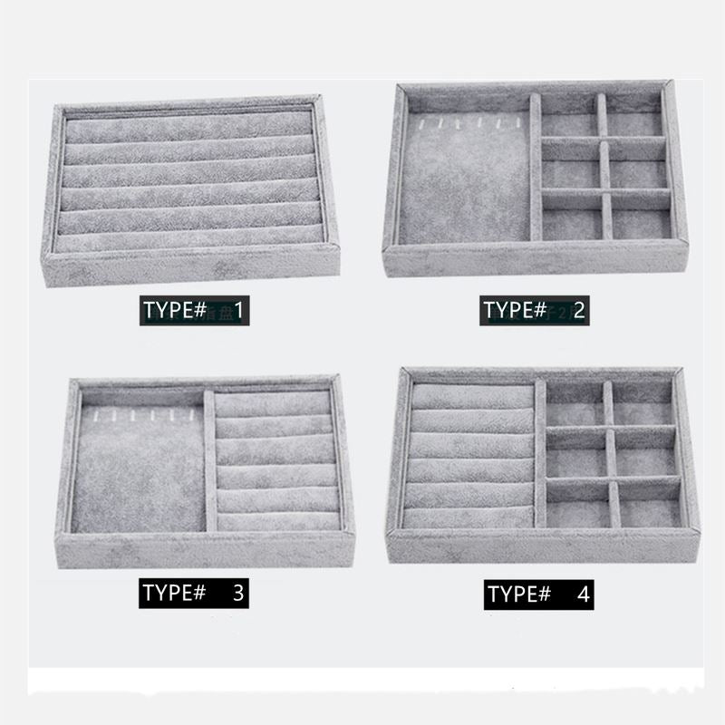 Gray velvet stackable jewelry organizer tray, ideal for displaying and storing accessories neatly.