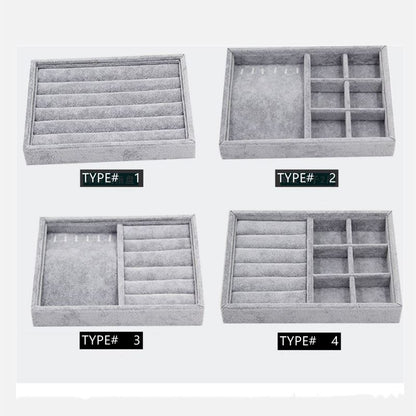 Gray velvet stackable jewelry organizer tray, ideal for displaying and storing accessories neatly.