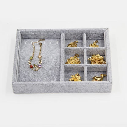 Gray velvet stackable jewelry organizer tray, perfect for neatly storing watch accessories and small items.
